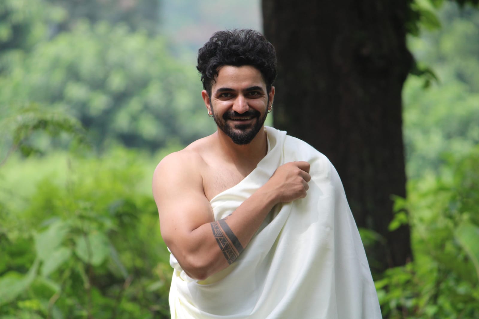Aditya Chamoli smiling confidently outdoors