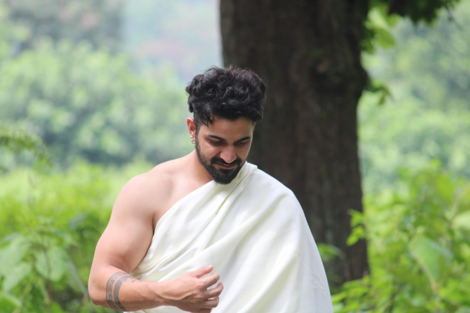 Aditya Chamoli outdoors in a relaxed, recovery-focused pose